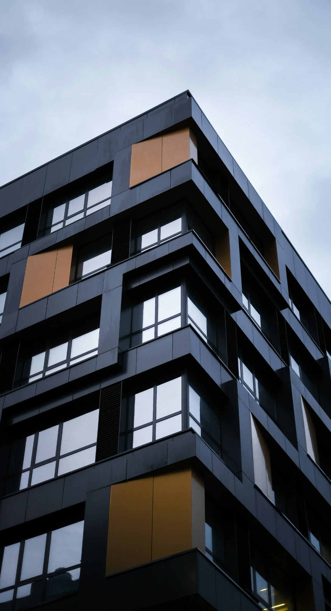 Modern commercial building architecture representing practical controls for existing buildings